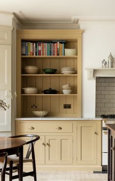 the kitchen is clean and ready to be used for cooking or dining room furniture, as well as bookshelves