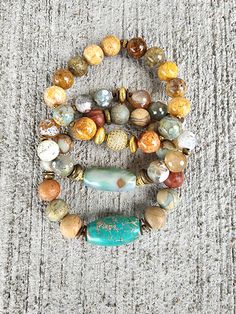 3 bracelet set: Sea Sediment Jasper gemstone bracelet with Jasper Gemstone focal bead; Fire Agate gemstone bracelet with gemstone focal barrel bead.;Natural Saddle Agate gemstone bracelet with pave focal Earthy Agate Beaded Bracelet For Meditation, Earthy Jasper Gemstone Bead Bracelets, Earthy Jasper Gemstone Beads Bracelet, Earthy Agate Beaded Bracelets For Healing, Rondelle Natural Stones Beaded Bracelets For Healing, Earthy Agate Beaded Bracelets With Natural Stones, Earthy Beaded Bracelets With Natural Agate Stones, Everyday Hand-strung Agate Beaded Bracelets, Healing Rondelle Beaded Bracelets With Natural Stones