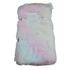 a pink and white furry blanket