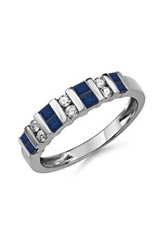 a white gold ring with blue stones