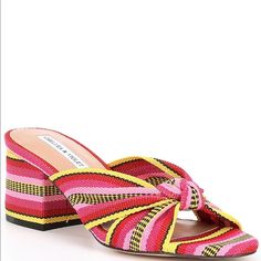 From Chelsea & Violet, The Gia Knot Printed Mules Feature: Fabric Upper With Knot Detail Slip On Design Synthetic Lining 4mm Latex Foam Footbed Synthetic Outsole Approx. 2.55" Heel Height Imported. Pink Yellow Black Red Multicolor Slip-on Heels For Spring, Multicolor Open Heel Summer Heels, Yellow Heels With Heel Strap For Summer, Multicolor Block Heel Sandals For Spring, Multicolor Block Heel Sandals For Summer, Summer Slip-on Heels With Wrapped Heel, Chic Multicolor Sandals For Summer, Yellow Heel Strap Sandals For Summer, Yellow Wrapped Heel Sandals For Summer