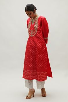 Red straight kurta featuring bandhani detailing all over with hand embroidered yoke in zardozi and an embroidered motif at the centre back. - Aza Fashions Red Chanderi Straight Kurta, Red Embroidered Slub Silk Kurta, Festive Bandhani Print Kurta For Transitional Season, Festive Transitional Bandhani Print Kurta, Red Silk Straight Kurta, Red Silk Traditional Wear With Dori Work, Red Straight Kurta With Dori Work, Fitted Chanderi Traditional Wear With Bandhani Print, Red Slub Silk Straight Kurta