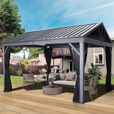 a patio covered with furniture and a gazebo on the deck in front of a house