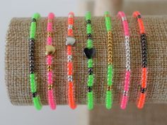 Seed bead bracelets with your choice of charm and metal accent. Size: You will receive a standard size bracelet which fits a 6 inch wrist unless noted. Custom size is available upon request. Leave your desired WRIST SIZE in the 'Notes' section during checkout. Follow our socials! IG: @mikayloveinc FB PAGE: Mikaylove Neon Bracelets, Braided Friendship Bracelets, Diy Friendship Bracelets Tutorial, Beaded Braclets, Bold Statement Jewelry, Layering Jewelry, Friendship Bracelets With Beads, Friendship Bracelets Tutorial, Stacking Bracelets