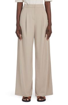 Stretch jersey adds a fluid drape to staple pants in a goes-with-everything shade. Zip fly with hook-and-bar closure Front slant-welt pockets 82% polyamide, 18% elastane Dry clean or hand wash, dry flat Imported Beige Wide-leg Pants For Evening, Beige Pants For Spring Evening, Beige Wide Leg Bottoms For Evening, Chic Beige Wide Leg Pants For Evening, Evening Pants With Belt Loops For Spring, Elegant Neutral Pants With Belt Loops, Elegant Neutral Bottoms With Belt Loops, Formal Neutral Wide Leg Pants For Spring, Spring Formal Neutral Wide Leg Pants