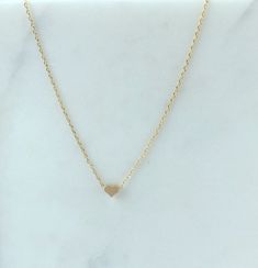 "Dainty necklace, gold Heart necklace, gold necklace, Dainty jewelry, gift for her, simple necklace, gift for women, dainty necklace, birthday gift for her Simple and dainty gold heart necklace. D E T A I L S: *5mm tiny gold plated heart *18\" gold plated chain *Lobster clasp closure This style is also available in rose gold and silver in our shop! SHIPPING: *Free domestic shipping on all orders PACKAGING: *All pieces come beautifully packaged, perfect for gift giving. Find more to ❤️ here: http Orders Packaging, Dainty Necklace Gold, Tarnished Jewelry, Dainty Gold Necklace, Gold Heart Necklace, Birthday Gift For Her, Necklace Dainty, Simple Necklace, Gold Heart