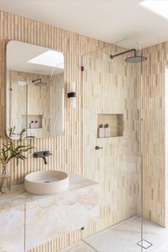 This bathroom highlights travertine tiles and brushed gunmetal tapware. Gunmetal Tapware, Interior Textures, Mosaic Wall Tiles