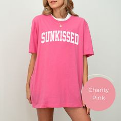 This Sunkissed Shirt, the perfect blend of style and comfort for all your summer adventures. This Oversized Summer Shirt is designed to keep you cool and stylish under the sun, making it an essential addition to your trendy beach clothes collection. Planning a girls' beach trip? This Sunkissed Beach Tshirt is your go-to choice. It's perfect for coordinating outfits with your friends and capturing those Instagram-worthy moments. All of our shirts are made with the highest quality materials and ar Graphic Print T-shirt For Summer Weekends, Pink T-shirt For Summer Loungewear, Spring Weekend Tops With Short Sleeves, Relaxed Text Print Top For Weekend, Relaxed Fit Text Print Top For Weekend, Spring Weekend Graphic Tee Tops, Graphic Tee Tops For Weekend Spring, Graphic Tee For Weekend In Spring, Spring Graphic Tee T-shirt For Weekend