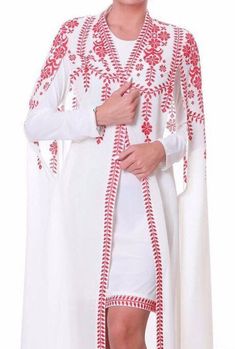 White Dresses With Cape Sleeves, Long White Dress With Intricate Embroidery, White Long Dress With Intricate Embroidery, White Embroidered Dress With Cape Sleeves, White Floral Embroidered Wedding Kaftan, White Long Sleeve Dresses With Geometric Embroidery, Traditional Embroidered Dress With Cape Sleeves, Traditional Long White Embroidered Dress, White Traditional Dress With Cape Sleeves