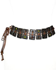 This tie belt is made with unique, embellished slider ornaments with Olive and Topaz colored stones on a brown cotton rope. 52" Full length One size adjustable Acrylic stones Imported Adjustable Brown Belts For Beach, Elegant Adjustable Belts For Festivals, Vintage Brown Jewelry For The Beach, Elegant Festival Belts, Adjustable Rope Belt For Summer, Vintage Brown Jewelry With Adjustable Length, Adjustable Rope Belt For Beach, Brown Adjustable Jewelry For Festivals, Brown Adjustable Festival Jewelry