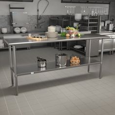 an industrial style kitchen with stainless steel tables and pots, pans and utensils