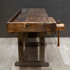 an old workbench sitting on top of a hard wood floor