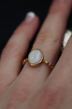 Opal ring, dainty opal gold filled ring for women. High quality Australian opal. Nice present for her. Available of different materials: -Rhodium plated sterling silver* -18k gold filled sterling silver -18 solid gold *Rhodium layer is used to make silver shine for a long time. Please, make sure you don't have allergy on rhodium. Size:  Please, choose the size you need. We use US sizes from 5-10. Our Ring Guide will help you to find the right size. If you don't see your size on the list or you h Opal Ring Aesthetic, Large Opal Ring, Classic Opal Moonstone Ring As Gift, Opal Birthstone Ring In White Gold, White Dainty Opal Gemstone Ring, Opal Birthstone Ring In White Gold For Gift, Classic White Opal Ring With Birthstone, Classic White Opal Birthstone Ring, White Dainty Opal Ring