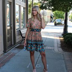 "Chase the sun in our stylish beach dress. Lightweight woven fabric, with a blue and blush floral print, shapes this dress that has a tying V-neckline and short sleeves. A blousy bodice tops an elastic waist and a tiered skirt that ends at a midi hem. * Elastic waist for better fit;  * Chest area fabric overlay to ensure coverage  * Breathable and Soft material, comfortable to wear for whole day * Wear it in Beach or get together * Dress sits above the Knee Size: Fit True to Size S Bust 32-36\" Waist 22-30\" Length 35.83\" M Bust 32-36\" Waist 25-33\" Length 36.61\" L Bust 38-42\" Waist 28-36\" Length 37.41\" XL Bust 42-45 Waist 31-39\" Length 38.18\"" Multicolor Boho Print Sundress For Spring, Multicolor Floral Print Summer Boho Dress, Multicolor Floral Print Boho Dress For Day Out, Boho Print Sundress For Spring, Floral Print Patterned Sundress For Vacation, Patterned Summer Sundress For Day Out, Summer Patterned Sundress For Day Out, Multicolor Bohemian Floral Dress For Vacation, Spring Boho Print Sundress