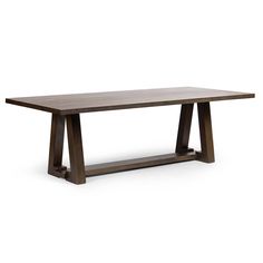 a wooden table sitting on top of a white floor