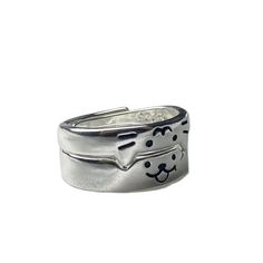 a silver ring with a dog on it