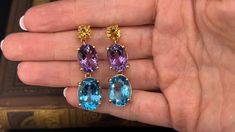 These striking dangle earrings are each accented with one (1) natural citrine, one (1) natural amethyst and one (1) natural topaz set into four- prong heads. The earrings measures 43.0mm in length and 12.2mm in width. The earrings are finished with friction style backs. The gems show light abrasion but nothing distracting. Gem Show, Show Lights, Greenish Blue, Ruby Jewelry, Natural Citrine, July Birthstone, One 1, High Quality Jewelry, Estate Jewelry