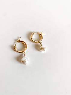 These little chubby small hoops with a freshwater pearl wire wrapped on are such a cute little statement earring while still being dainty enough to wear everyday! made from 14k Gold filled Minimalist 14k Gold-filled Hoop Earrings With Pearl Charm, Small Hoop Earrings With Pearl Charm In 14k Gold, Small Hoop Pearl Drop Earrings In 14k Gold Filled, Delicate Small Hoop Pearl Earrings With Pearl Charm, 14k Gold-filled Huggie Hoop Earrings With Pearl Charm, Dainty Pearl Huggie Earrings, Minimalist 14k Gold Filled Huggie Earrings With Pearl Charm, Dainty Small Hoop Pearl Earrings With Charm, Dainty Gold Hoop Pearl Earrings