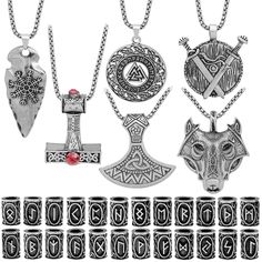 an assortment of viking necklaces and pendants with various symbols on them, all in different shapes and sizes