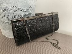 "Gorgeous black sparkly evening bag with detachable chain and silver hardware. This lovely little clutch bag would suit any special occasion. In fantastic condition 8.5\"/21.5cm x 4\"/10cm" Glamorous Evening Clutch With Glitter, Glamorous Glitter Clutch For Evening, Glitter Clutch Evening Bag For Event, Glitter Clutch Evening Bag, Glitter Clutch Evening Bag For Events, Chic Evening Clutch With Glitter, Rectangular Glitter Evening Bag For Formal Events, Silver Glitter Clutch For Formal Occasions, Silver Glitter Clutch For Events