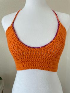 This custom/made to order, crochet backless bralette/cropped halter with a low-cut scoop neck, is versatile and will effortlessly transition from day to night. Pair it with your favourite jeans for a casual yet chic look, or dress it up a bit with a high waisted skirt for a more sophisticated ensemble. The timeless appeal of crochet makes this top a wardrobe staple that will never go out of style. Yarn always tends to stretch, so I typically recommend sizing down 1/2 size! Spring Festival Crop Top With Built-in Bra, Bohemian Halter Top With Built-in Bra, Festival Bra Friendly Halter Neck Top, Festival-ready Bra-friendly Halter Neck Top, Festival Halter Neck Top, Bra Friendly, Summer Backless Crop Top With Built-in Bra, Chic Backless Crop Top For Festival, Festival Halter Neck Crop Top, Bra Friendly, Festival Halter Neck Crop Top Bra Friendly