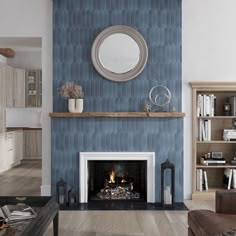 a living room filled with furniture and a fire place in front of a blue wall