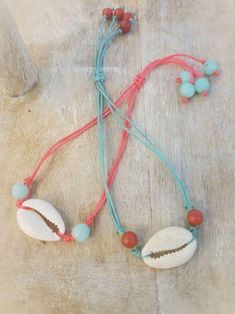 Cowrie Shell Necklaces/Bracelets - Assorted colors - Summer Indigo Bohemian Bracelet With Sliding Knot, Bohemian Sliding Knot Bracelet, Beach Jewelry Bracelet With Adjustable Length, Bohemian Turquoise Jewelry With Waxed Cord, Bohemian Turquoise Jewelry On Waxed Cord, Bohemian Jewelry In Turquoise With Waxed Cord, Bohemian Jewelry In Turquoise Waxed Cord, Spiritual Beach Friendship Bracelets With Sliding Knot, Spiritual Friendship Bracelets With Sliding Knot For Beach