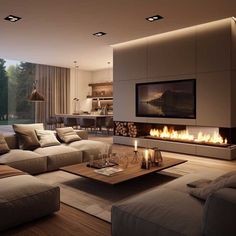 a modern living room with fireplace and large couches in front of the tv on the wall