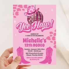 a person holding up a pink card with a cowboy hat on it that says yee haus