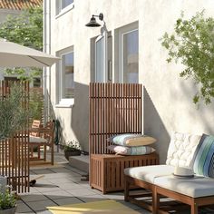 a wooden bench sitting on top of a patio