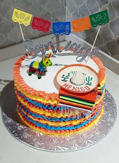 a birthday cake decorated with colorful decorations