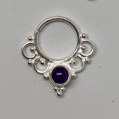 "These are soooooo pretty. Made is 925 sterling silver with tribal details, set with a bright amethyst stone. The rings are all 1cm (.40\") in diameter. The wire is 20 gauge. Stones shine light through them since the back is open. Hard to see this when they are lying flat in the pic. Each piece is made BY HAND One of the images contains numbers to specify which you would like from the drop down menu." Spiritual Silver Amethyst Ring In Sterling Silver, Sterling Silver Body Jewelry, Pierced Sterling Silver Belly Rings, Nickel Free Sterling Silver Belly Rings, Silver Sterling Belly Rings, Nickel-free Sterling Silver Belly Rings, Silver Amethyst Bohemian Ring, Nickel-free Silver Amethyst Ring In Sterling Silver, Silver Spiritual Amethyst Ring