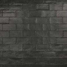 a black and white photo of a brick wall