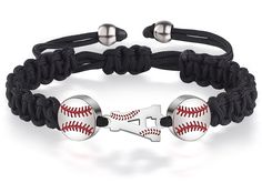 a baseball bracelet with two metal balls on it