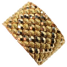 Audaciously gold, this finely Italian made bracelet is superb in rich eighteen karat 18K yellow gold. Striking marquise links in complementing bright polish and textured finishes boldly wraps the wrist in this generous 1-5/8 inch wide flexible cuff style bracelet. The length measurement of this extraordinary piece is is 7-5/8 inches and it is finished with a box clasp and two safety clips. Gift boxed. Pyramid Bracelet, Faceted Bead Bracelet, Flexible Bracelet, Retro Bracelet, 18k Gold Bracelet, Expensive Jewelry Luxury, White Gold Hoops, Gold Link Bracelet, Rose Gold Beads