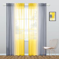 a chair sitting in front of a window with yellow curtains