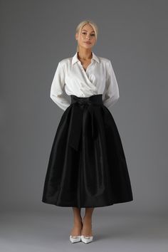 Taffeta skirt with sash included. Skirt has a pockets. Taffeta skirt makes a classical elegant look. This skirt is perfect for any occasion.  Waistline can be made wider or more narrow. Skirt can be made longer or shorter.  More skirts you can see here:  https://www.etsy.com/shop/DesirCouture?ref=seller-platform-mcnav&section_id=40312230 Skirt length 31.5 inches / 80 cm.  In order's note you can write your waist measurements and I will make according to your size. Standard Waist sizes: XXS 24.5 Black Taffeta Skirt, Couture Bridesmaid Dresses, Cocktail Skirts, Taffeta Skirt, Gown Skirt, Wedding Skirt, Classic Skirts, Womens Skirts, Formal Skirt