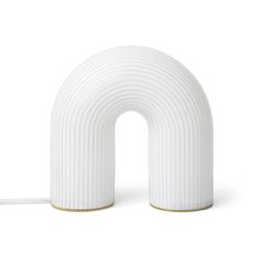 a white lamp with a curved design on it