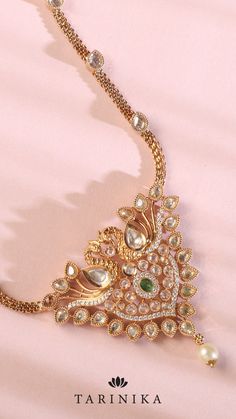 Embrace the magnificent allure of our pendant necklace featuring a peacock design embellished with dazzling CZ stones. This remarkable piece highlights the meticulous craftsmanship and intricate embellishments that breathe life into the peacock, capturing its elegance and grandeur. Piece Highlights, Peacock Pendant, The Peacock, Peacock Design, Cz Necklace, South Indian Wedding, Temple Jewellery, Cz Stone, Indian Wedding