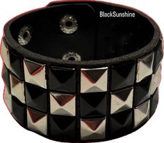 Black Punk Wristband For Concert, Black Rocker Bracelet With Studs, Black Rocker Style Leather Bracelet With Studs, Black Punk Leather Bracelet, Black Edgy Wristband With Studs, Black Spiked Festival Bracelets, Black Spiked Bracelets For Festival, Black Festival Bracelets With Spikes, Black Rock Style Wristband For Concerts