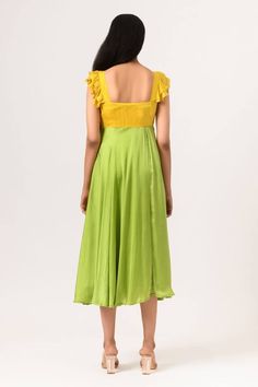 Yellow and green color block dress with front sweetheart neckline and umbrella cut sleeves.
Component: 1
Pattern: Plain
Neckline: Sweetheart
Sleeve Type: Cap
Fabric: Sustainable Silk
Color: Green, Yellow
Other Details: 
Ruffle sleeves
Back square neckline
Occasion: Resort - Aza Fashions Green Dress With Ruffles And Sweetheart Neckline, Green Midi Dress With Pleated Bodice, Green Summer Dresses With Cape Sleeves, Green Summer Dress With Cape Sleeves, Fitted Bodice Green Dress With Ruffles, Green Fitted Dress With Cape Sleeves, Green Cape Sleeve Dress For Spring, Green Spring Dress With Cape Sleeves, Green Midi Dress With Fitted Bodice