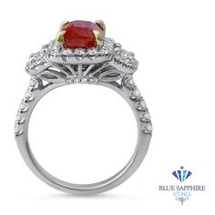 One of a kind untreated ruby three stone ring surrounded by a diamond halo and diamond studded band Great as an engagement ring or anniversary present! GIA certified! Ruby and white gold are a match made in jewelry heaven. We cannot get enough of this combination - the hues compliment each other quite perfectly! If you're looking for the ring of your (or your significant other's) dreams, then look no further. This is the perfect ring to have when you're ready to pop the question. The center ston Gia Certified Diamond Ruby Ring For Anniversary, Anniversary Gia Certified Ruby Diamond Ring, Gia Certified Lab-created Ruby Diamond Ring For Anniversary, Anniversary Gia Certified Lab-created Ruby Diamond Ring, Gia Certified Lab-created Ruby Diamond Ring For Wedding, Gia Certified Lab-created Ruby Diamond Wedding Ring, Red Diamond Ring With Halo Setting In Platinum, Red Diamond Halo Ring With Center Stone, Red Diamond Ring With Halo