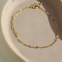 Timeless with a vintage style, the Sylvie Bracelet adds a little sparkle to your wrist! This bracelet is ideal for stacking amongst bolder chains like our Demi Alex or wear it alone for an easy elevated look. DETAILSBracelet Sizing: XS= 5.5", S=6", M=6.5", L=7", XL=7.5".5" adjustable spring hook clasp To measure your wrist size, wrap a piece of string around your wrist the way you would like the bracelet to fit. Then lay the string flat and measure the inches to get your size. Each piece of Toke Delicate Chain, Hook Clasp, Ring Size Guide, Handmade Fashion, Custom Rings, Sterling Silver Bracelets, Jewelry Care, Ring Necklace, Rose Gold Plates