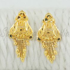 Celebrate the essence of Indian heritage with these radiant 22k gold earrings. Each earring is meticulously designed with traditional patterns that catch the light and add a regal touch to your look. Perfect for both festive occasions and elegant evenings, these earrings are a testament to the rich history of Indian jewelry, offering a blend of classic beauty and modern sophistication. 22k gold earrings handmade jewelry made in India Metal real gold, Purity 22k gold,  length is 2.8 centimeter an Festive 22k Yellow Gold Bridal Earrings, Gold Danglers For Ceremonial Diwali, Gold Danglers For Diwali Ceremonial Events, Gold Danglers For Ceremonial Occasions During Diwali, Gold Danglers For Ceremonial Occasions, Diwali Festival, Gold-plated Meenakari Danglers, Yellow Gold Meenakari Danglers For Diwali, Diwali 22k Gold Jhumkas, Traditional Yellow Gold Danglers For Puja