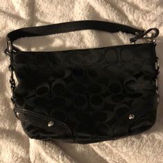 Small Black Coach Bag In Great Condition. Looks Brand New. Casual Black Bags With Branded Hardware, Trendy Black Coach Bag, Casual Black Coach Bag, Trendy Black Coach Shoulder Bag, Coach Black Pouch Bag, Black Coach Hobo Bag With Adjustable Strap, Coach Black Hobo Bag For Daily Use, Coach Black Crossbody Hobo Bag, Coach Bag Blck