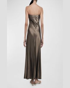 Find ENZA COSTA Strapless Satin Bias Maxi Dress on Editorialist. This Enza Costa dress is made of lustrous satin. It features a strapless neckline, sleeveless style, and a full length. The dress has a bodyskimming fit and a slip-on style. It is made in the USA and measures approximately 55 inches from the shoulder to hem. Pre-draped Satin Strapless Dress For Gala, Luxury Strapless Satin Dress, Pre-draped Satin Strapless Cocktail Dress, Pre-draped Silk Strapless Evening Dress, Pre-draped Satin Slip Dress For Evening, Glamorous Satin Strapless Evening Dress, Evening Satin Strapless Dress For Gala, Strapless Silk Evening Dress For Parties, Glamorous Fitted Silk Strapless Dress