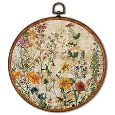 a round wooden frame with flowers painted on the outside and inside, hanging from a wall