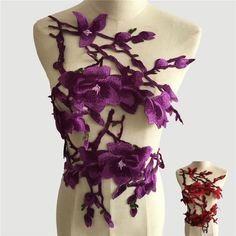 a white mannequin with purple flowers on it