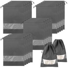 six black and white bags with zippers on them