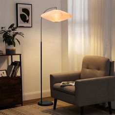 a living room scene with focus on the floor lamp